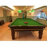 A Burroughes and Watts full size snooker table, the green baise surface raised on square, tapered,