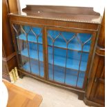 A 1930s mahogany bow front two door display cabinet,