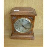 An early/mid 20thC oak cased mantel clock;