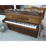 A modern Hupfeld teak cased iron framed and overstrung upright piano No.