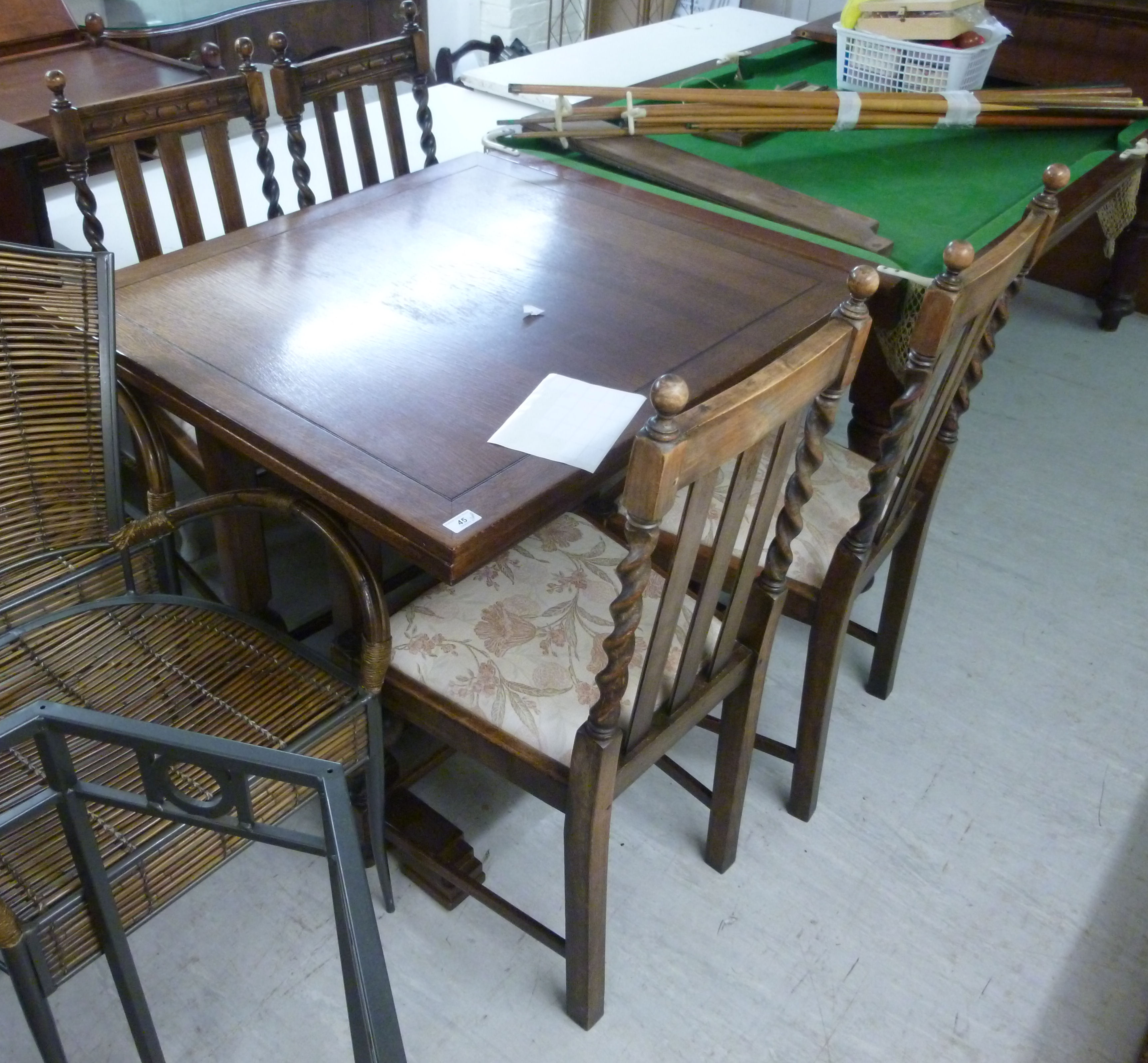 A 1930s oak draw leaf dining table,