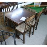 A 1930s oak draw leaf dining table,