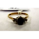 A 9ct gold claw set sapphire and diamond ring 11