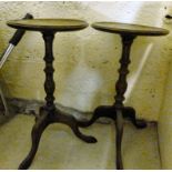 A pair of early 20thC oak wine tables, each with a knopped column,