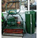 An Atco petrol driven cylinder lawn mower with a 24'' cut F