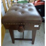 An early 20thC mahogany framed piano stool with a rising, button upholstered vinyl seat,