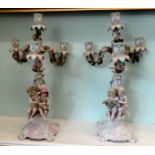 A pair of late 19thC (possibly Limoges) porcelain candelabra,