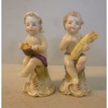 A pair of late 19thC Naples porcelain miniature cherubs, viz.