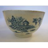 A late 18thC Worcester porcelain tea bowl, decorated in blue and white with flora,