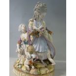 A late 19thC Meissen porcelain allegorical group 'Broken Eggs' two female figures and a kneeling