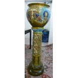 A late Victorian Burmantoft faience jardiniere of baluster form with a flared lip,