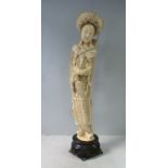 An early 20thC Japanese carved ivory figure with incised black ink decoration,