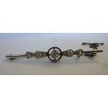 An 18ct white gold and diamond set bar brooch,