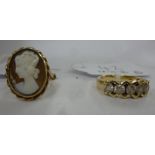 A 9ct gold cameo ring; and a yellow metal ring,