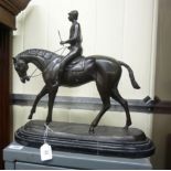 A modern bronze finished model, a mounted jockey,