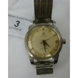 An Omega Seamaster stainless steel cased automatic wristwatch, faced by a silvered baton dial,