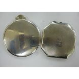 A silver backed circular 'handbag mirror' with a bevelled plate and folding handle; and a silver,