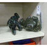 Two Canadian Inuit carved green serpentine stone models,