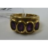 A gold coloured metal ring,