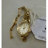 A lady's Accurist 9ct gold cased bracelet watch,