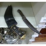 A late 19th/early 20thC possibly European dagger with a horn handle; and a contemporary kukri,