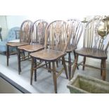 A set of seven early 20thC beech and elm framed hoop and stick back Windsor chairs,