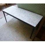 A mid 20thC retro coffee table, the off-white ceramic tiled top,