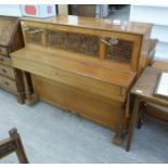 A mid Victorian John Broadwood & Sons mahogany cased upright piano with fretworked panelled front