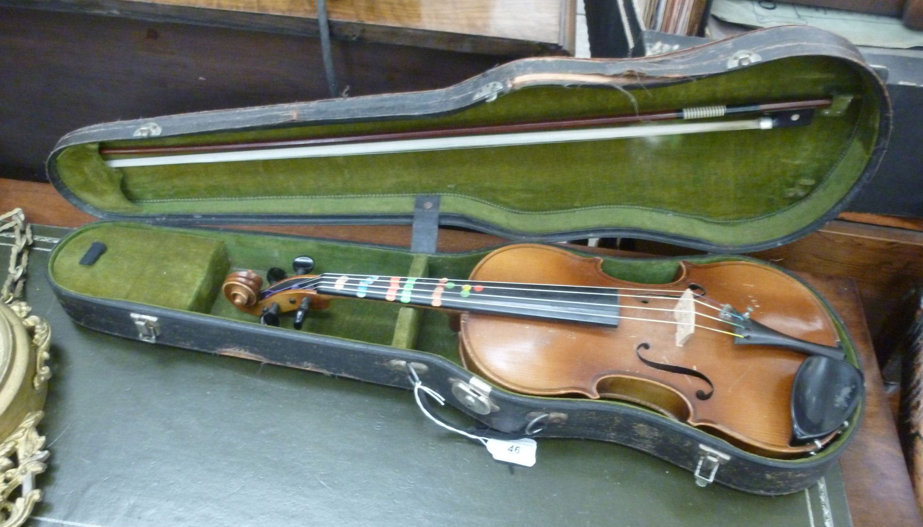 A violin with a two piece back 14''L in a fitted hard carrying case RAM