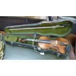 A violin with a two piece back 14''L in a fitted hard carrying case RAM