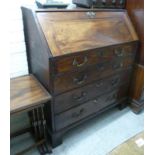 A George III mahogany four drawer bureau,