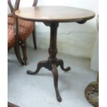 A George III mahogany pedestal table with a tapered, baluster column,