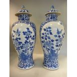 A pair of late 19thC Chinese Export porcelain temple jars and covers,