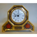 A Royal Crown Derby bone china, hexagonal cased timepiece on moulded bracket feet,