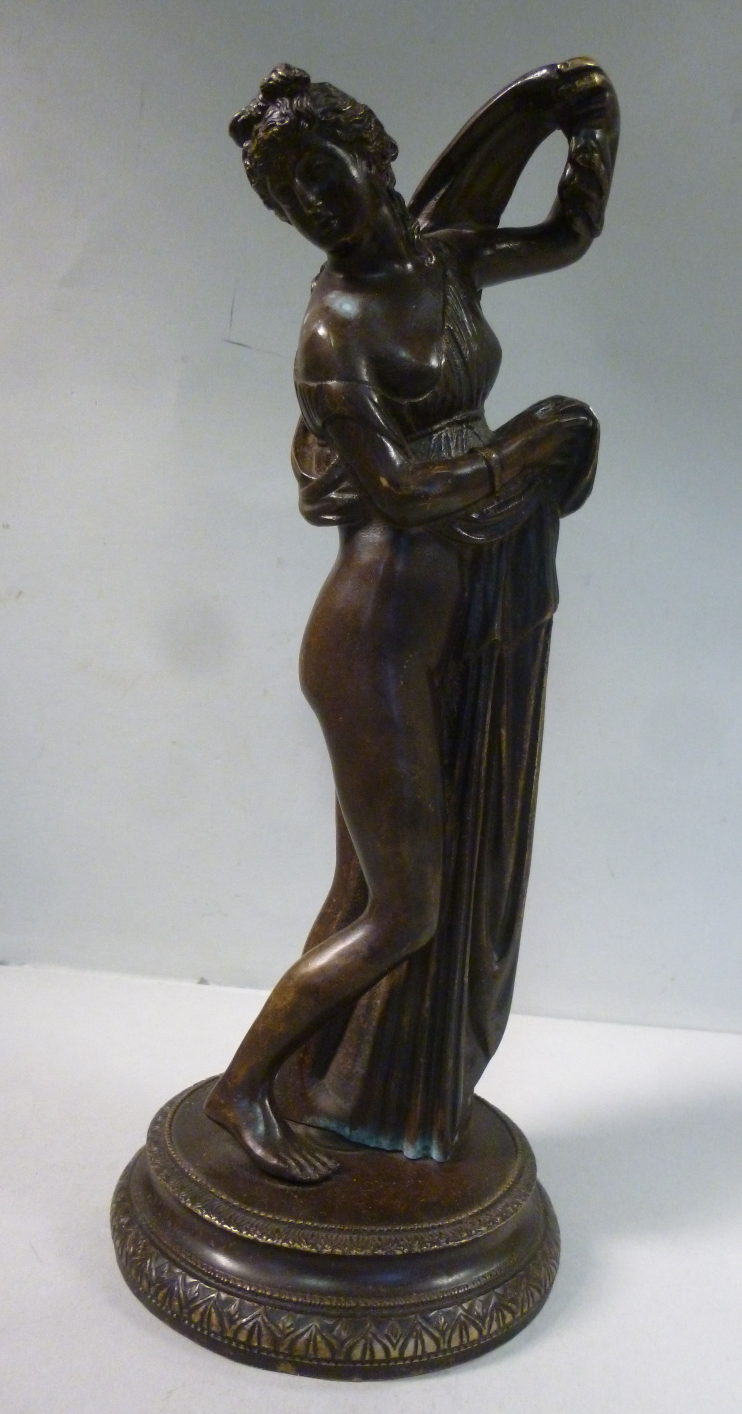 An early 20thC cast and patinated bronze figure, a partially robed, standing classical maiden, - Image 2 of 8