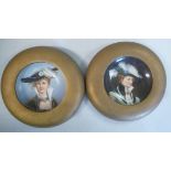 A pair of early 20thC (probably Austrian) painted porcelain bowl plaques,