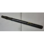 A late 19thC police wooden truncheon, painted in yellow SC, on a dark blue ground, on a ribbed,