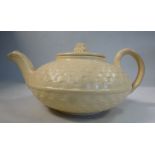 A late 18th/early 19thC Wedgwood moulded basketweave and cream coloured glazed earthenware teapot