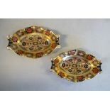 A pair of Royal Crown Derby bone china oval, serpentine outlined pin dishes,