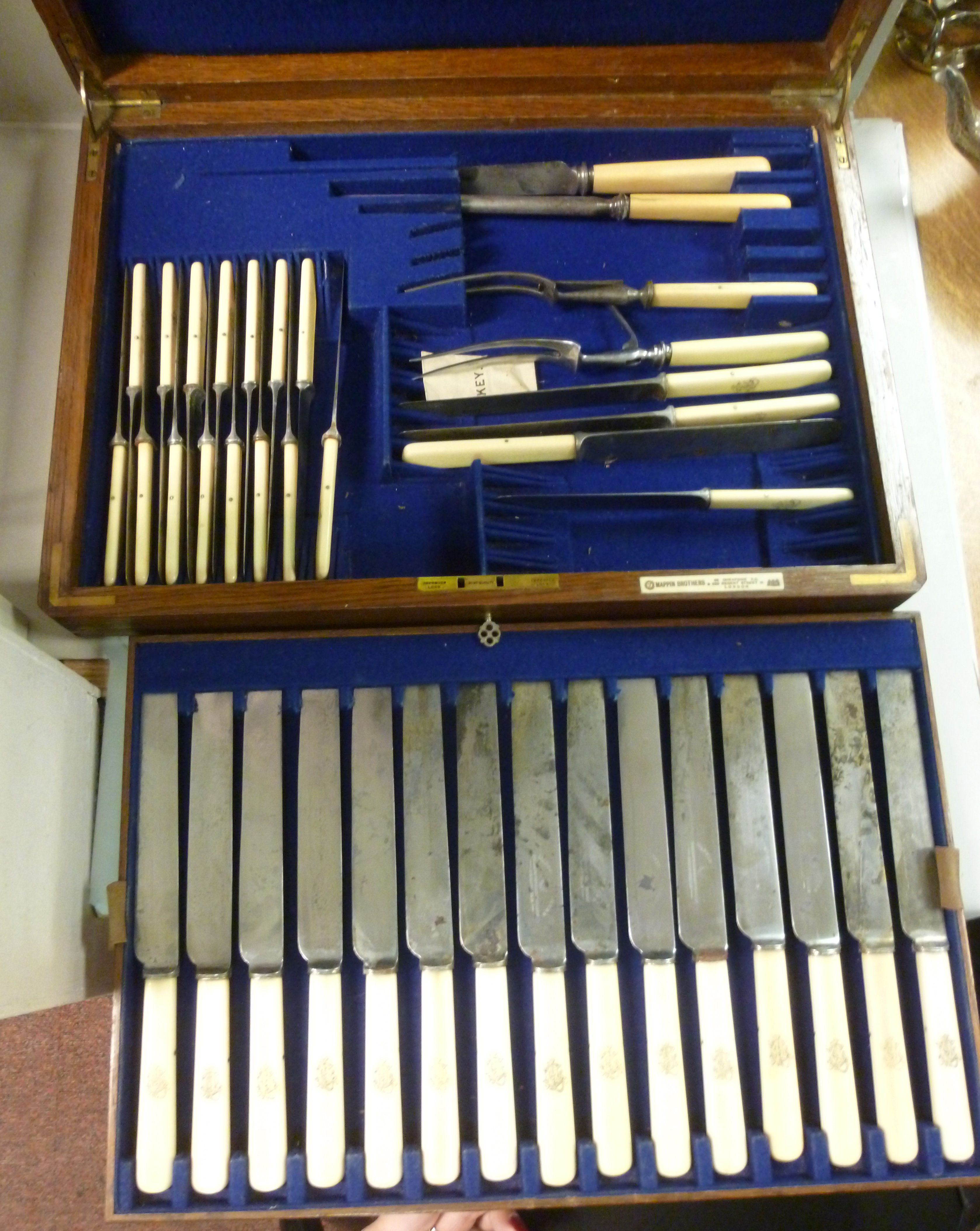 A canteen of mid 19thC Mappin Brothers bone handled steel cutlery, in a light oak,