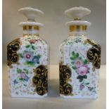 A pair of mid/late 19thC porcelain toiletry bottles of chamfered shouldered, square form,