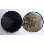 An early 19thC black lacquered papier mache shallow, circular snuff box,