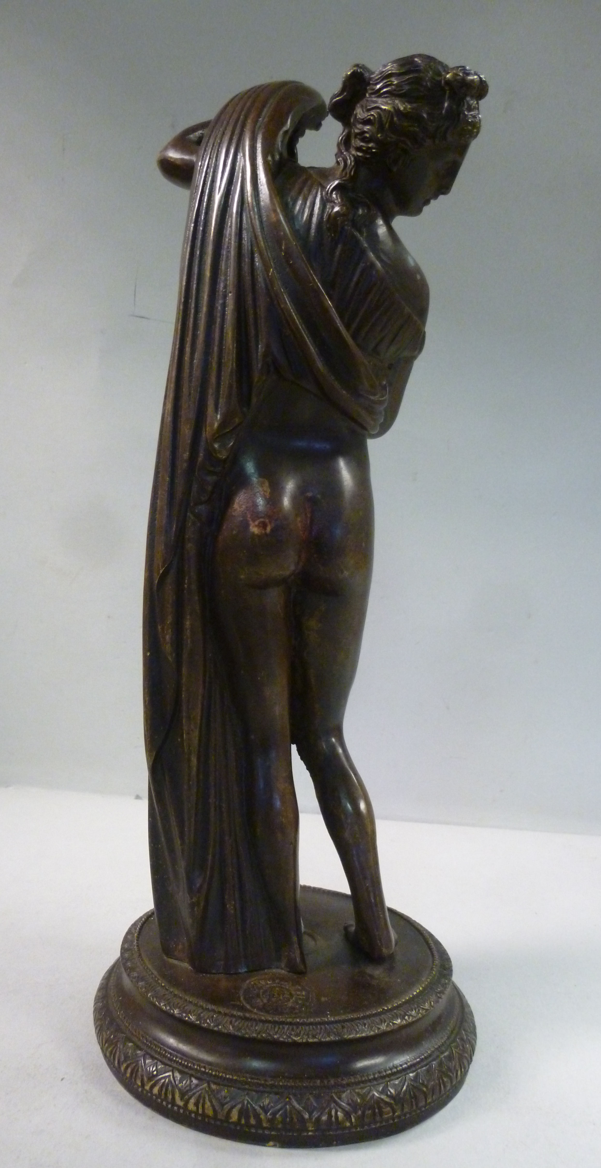 An early 20thC cast and patinated bronze figure, a partially robed, standing classical maiden, - Image 5 of 8