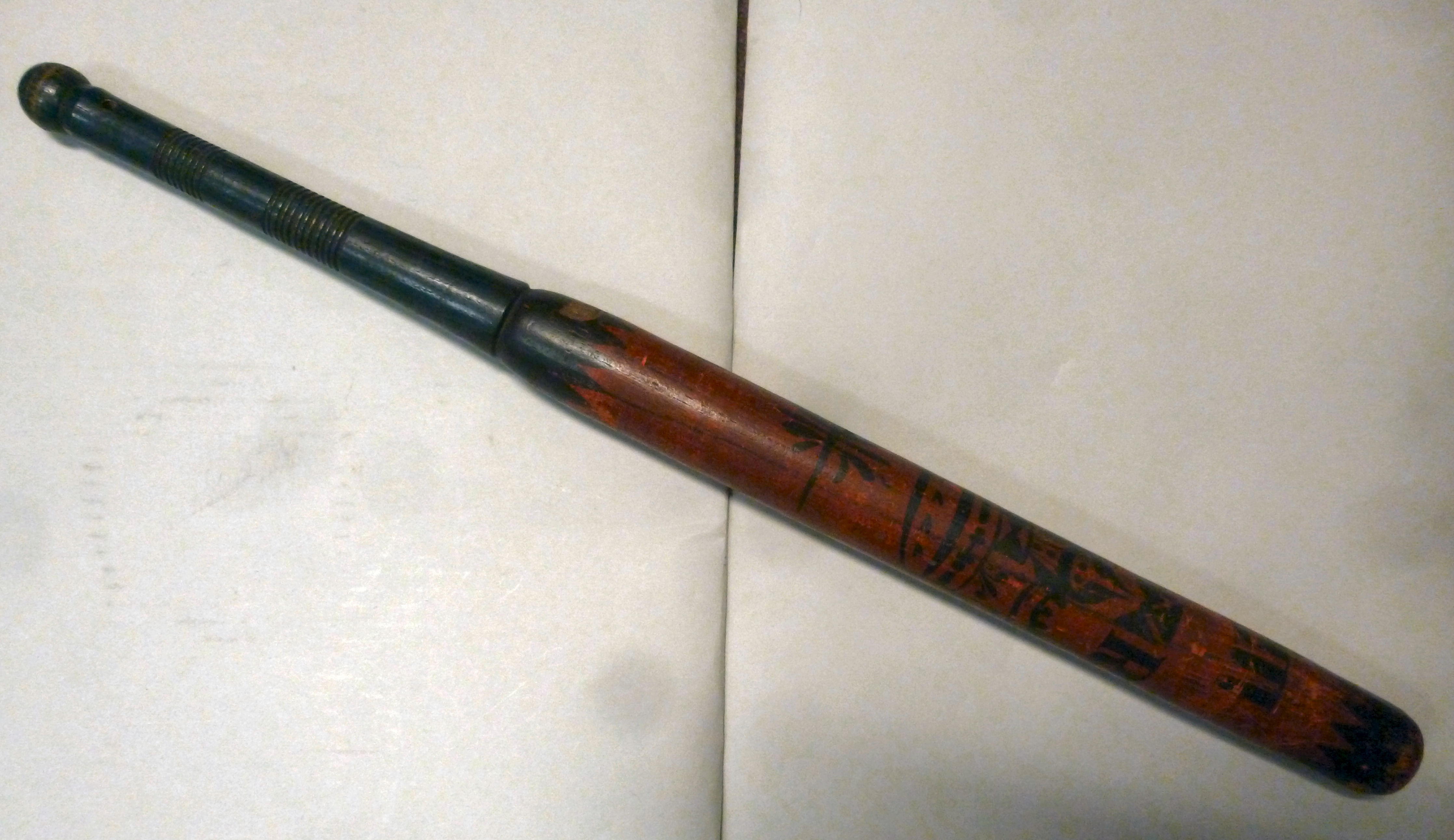 A William IV red, black and green painted wooden nightstick for City of London and the West End,