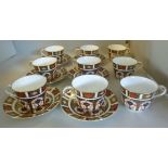 A set of nine Royal Crown Derby bone china tea cups and six saucers,