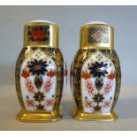 A pair of Royal Crown Derby bone china salt and pepper pots of bulbous square outline,