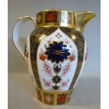 A Royal Crown Derby bone china cream jug of oval tapered form,