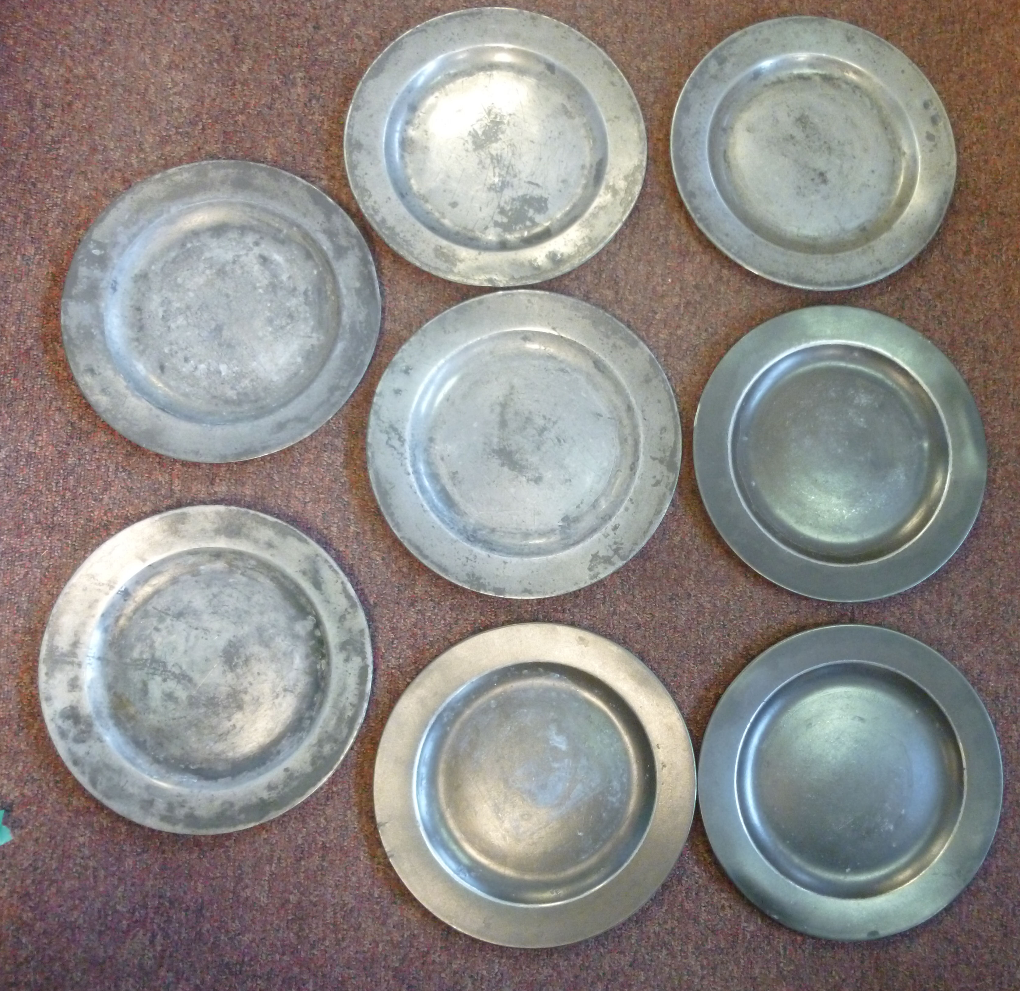 A set of eight 18th/19thC John Townsend pewter broad rimmed plates 9.