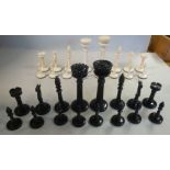 An early 20thC turned and carved bone, naturally coloured and black lacquered chess set,