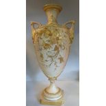 A Royal Worcester gilded blush ivory glazed and moulded china vase of shouldered, ovoid form,